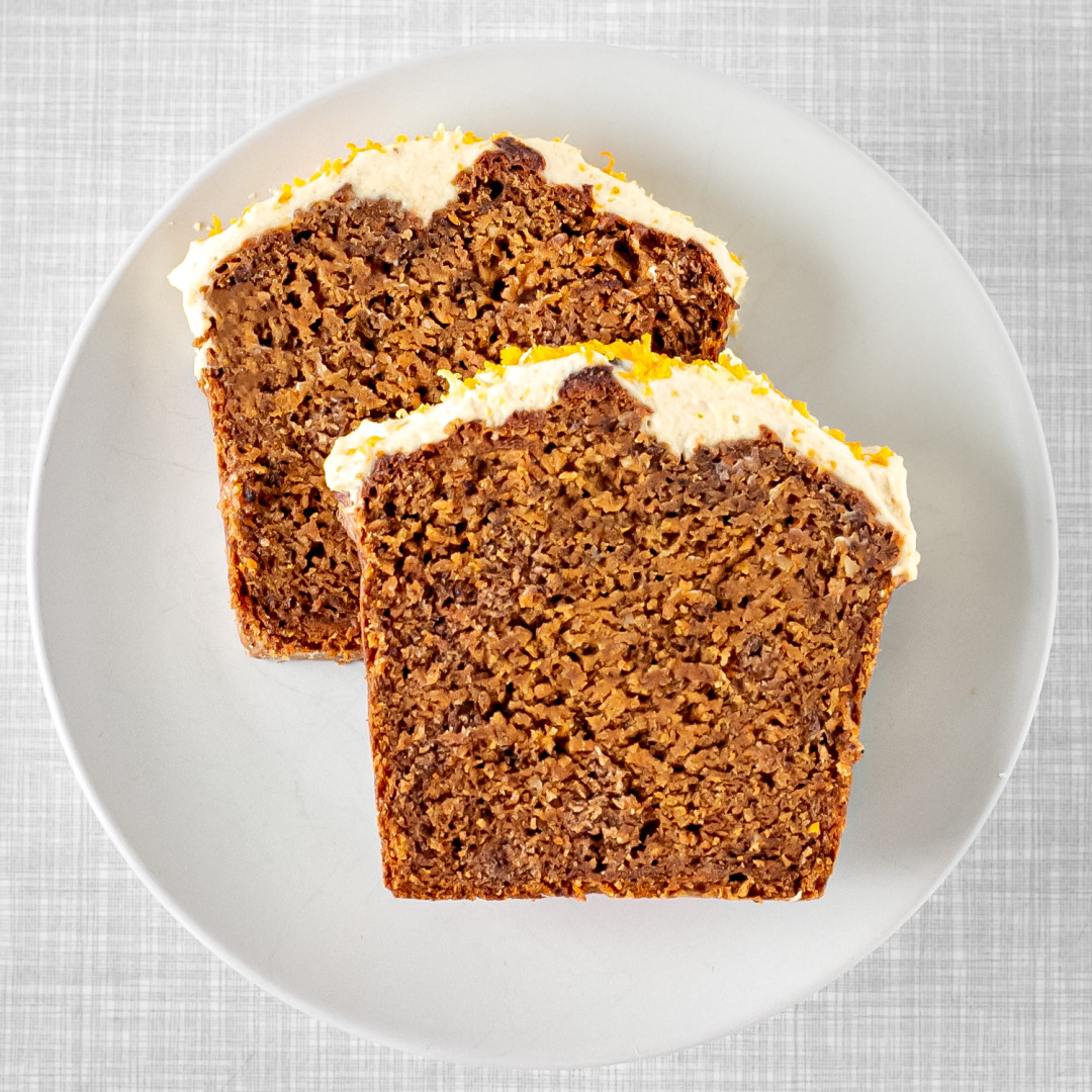 Two slices of a ​​moist vegan carrot cake on a plate